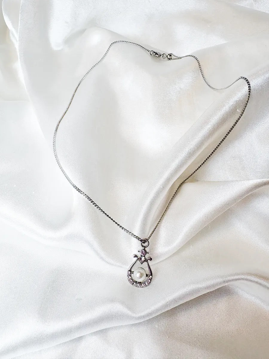 The Silver Pearl Lyre Necklace